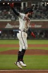 Atlanta Braves' Dansby Swanson celebrates his home run during the seventh inning in Game 4 of baseball's World Series between the Houston Astros and the Atlanta Braves Saturday, Oct. 30, 2021, in Atlanta. (AP Photo/Ashley Landis)