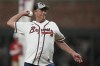 Former Atlanta Braves pitcher Greg Maddux throws out the ceremonial first pitch before Game 5 of baseball's World Series between the Houston Astros and the Atlanta Braves Sunday, Oct. 31, 2021, in Atlanta. (AP Photo/David J. Phillip)