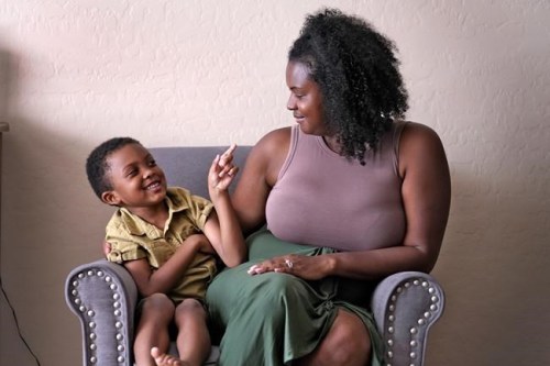 Kisha Gulley appears with her son Santana, 5, Friday, Sept. 3, 2021 in Phoenix. Gulley is an Instagram influencer and blogger who generates income from her content. (AP Photo/Matt York)