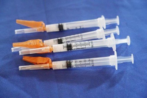 Syringes loaded with the Pfizer COVID-19 vaccine lie ready for use by a nurse, in Jackson, Miss., on Sept. 21, 2021. The Food and Drug Administration has paved the way for children ages 5 to 11 to get Pfizer’s COVID-19 vaccine. The agency authorized the kid-size doses on Friday, Oct. 29. (AP Photo/Rogelio V. Solis)