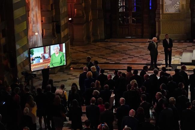 Britain's Queen Elizabeth II makes a video message to attendees of an evening reception to mark the opening day of the COP26 U.N. Climate Summit, in Glasgow, Scotland, Monday, Nov. 1, 2021. The U.N. climate summit in Glasgow gathers leaders from around the world, in Scotland's biggest city, to lay out their vision for addressing the common challenge of global warming. (AP Photo/Alberto Pezzali, Pool)