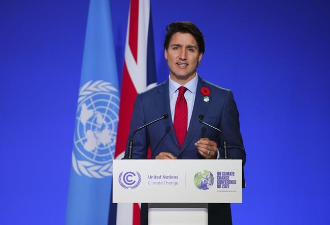 Prime Minister Justin Trudeau delivers a short speech at at the 26th meeting of the Council of Parties to the UN climate convention, known as COP26, in Glasgow, Scotland, on Monday, Nov. 1, 2021. Trudeau will push the world to negotiate a minimum price on pollution at the COP26 climate talks in Glasgow today. THE CANADIAN PRESS/Sean Kilpatrick