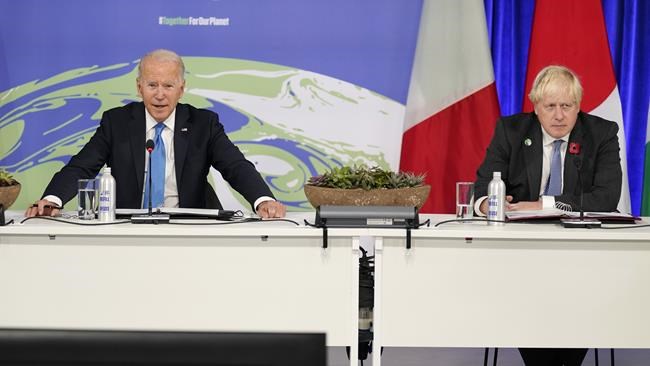 President Joe Biden and British Prime Minister Boris Johnson attend a meeting on the