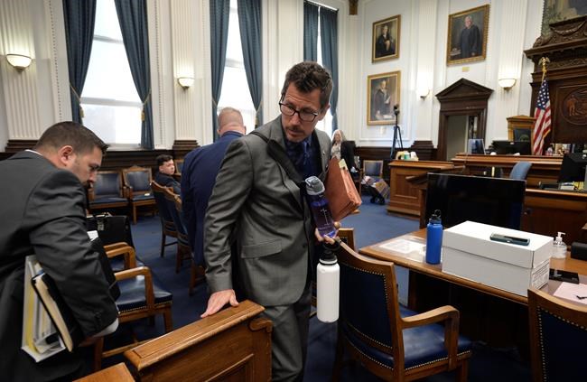 Assistant District Attorney Thomas Binger makes his way into the courtroom for Ky'e Rittenhouse's trial at the Kenosha County Courthouse in Kenosha, Wis, on Monday, Nov. 2, 2021. Rittenhouse is accused of killing two people and wounding a third during a protest over police brutality in Kenosha, last year. (Sean Krajacic/The Kenosha News via AP, Pool)
