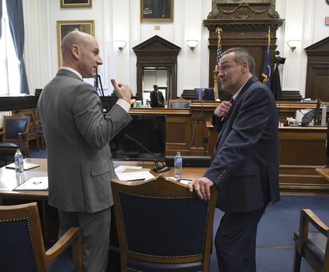 Kyle Rittenhouse defense attorneys Mark Richards and Corey Chirafisi talk before the start of Kyle Rittenhouse's trial at the Kenosha County Courthouse in Kenosha, Wis, on Tuesday, Nov. 2, 2021. Rittenhouse is accused of killing two people and wounding a third during a protest over police brutality in Kenosha, last year. (Mark Hertzberg /Pool Photo via AP)