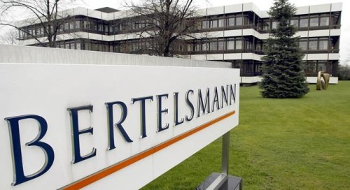 FILE - This March 13, 2003 file photo shows an outside view of the German media giant Bertelsmann in Guetersloh, Germany. U.S. regulators are suing to block a $2.2 billion book publishing deal that would have reshaped the industry, saying consolidation would hurt authors and readers. German media giant Bertelsmann’s Penguin Random House, already the largest American publisher, wants to buy New York-based Simon & Schuster, whose authors include Stephen King, Hillary Clinton and John Irving, from TV and film company ViacomCBS.  (AP Photo/Michael Sohn, File)