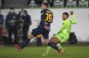 Wolfsburg's Lukas Nmecha, right, scores his side's second goal in front Salzburg's Maximilian Woeber during the Champions League group G soccer match between VfL Wolfsburg and Salzburg at the Volkswagen Arena stadium in Wolfsburg, Germany, Tuesday, Nov. 2, 2021. (AP Photo/Michael Sohn)