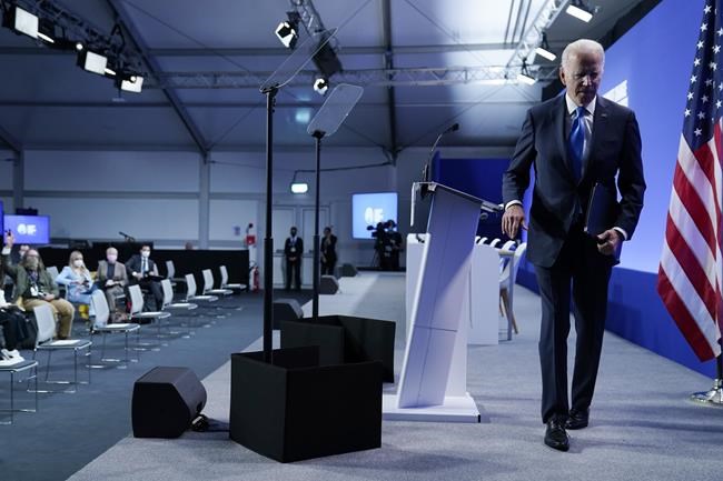 President Joe Biden walks off the stage after speaking during a news conference at the COP26 U.N. Climate Summit, Tuesday, Nov. 2, 2021, in Glasgow, Scotland. (AP Photo/Evan Vucci)