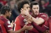 Bayern's Serge Gnabry, from left, Bayern's Leroy Sane and Bayern's Robert Lewandowski celebfrate after scoring during the Champions League group E soccer match between Bayern Munich and Benfica Lisbon in Munich, Germany, Tuesday, Nov. 2, 2021.(AP Photo/Matthias Schrader)