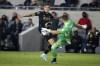 Los Angeles FC forward Brian Rodriguez, left, challenges Vancouver Whitecaps goalkeeper Maxime Crepeau during the first half of an MLS soccer match Tuesday, Nov. 2, 2021, in Los Angeles. (AP Photo/Ringo H.W. Chiu)