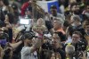 Atlanta Braves left fielder Eddie Rosario holds up the trophy after winning baseball's World Series in Game 6 against the Houston Astros Tuesday, Nov. 2, 2021, in Houston. The Braves won 7-0. (AP Photo/Sue Ogrocki)