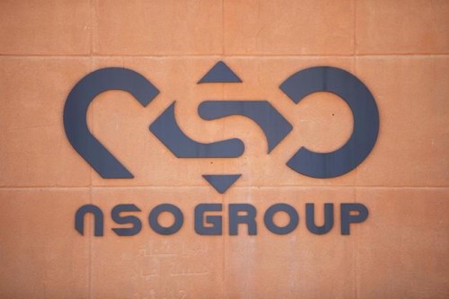 FILE - A logo adorns a wall on a branch of the Israeli NSO Group company, near the southern Israeli town of Sapir on Aug. 24, 2021. The Biden administration announced Wednesday, Nov. 3, that it is putting new export limits on two Israeli hacker-for-hire companies — including the well-known spyware company NSO Group — saying their tools have been used to 