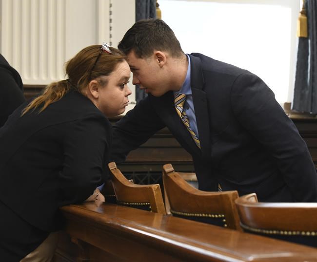 Wendy Rittenhouse, left, talks to her son Kyle Rittenhouse, before the start of his trial at the Kenosha County Courthouse in Kenosha, Wis., on Wednesday, Nov. 3, 2021. Rittenhouse is accused of killing two people and wounding a third during a protest over police brutality in Kenosha, last year. (Mark Hertzberg/Pool Photo via AP)