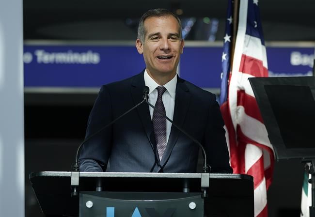 FILE - In this May 24, 2021, file photo, Los Angeles Mayor Eric Garcetti speaks at a news conference at Los Angeles International Airport, in Los Angeles. Los Angeles Mayor Eric Garcetti, who is on a trip to the UN climate conference in Scotland, tested positive for COVID-19 on Wednesday, Nov. 3, 2021, his office said in a posting on his official Twitter account.