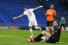 Real Madrid's Karim Benzema, left, celebrates after scoring the opening goal during a Group D Champions League soccer match between Real Madrid and Shakhtar Donetsk at the Santiago Bernabeu stadium in Madrid Spain, Wednesday, Nov. 3, 2021. (AP Photo/Manu Fernandez)