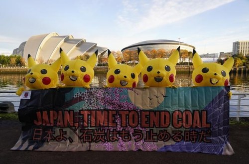 Activists dressed as the Pokemon character Pikachu protest against Japan's support of the coal industry near the COP26 U.N. Climate Summit in Glasgow, Scotland, Thursday, Nov. 4, 2021. The U.N. climate summit in Glasgow gathers leaders from around the world, in Scotland's biggest city, to lay out their vision for addressing the common challenge of global warming. (AP Photo/Alberto Pezzali)