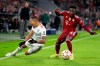 Bayern's Alphonso Davies, right, stops Benfica's Gilberto during the Champions League group E soccer match between Bayern Munich and Benfica Lisbon in Munich, Germany, Tuesday, Nov. 2, 2021. THE CANADIAN PRESS/AP-Matthias Schrader