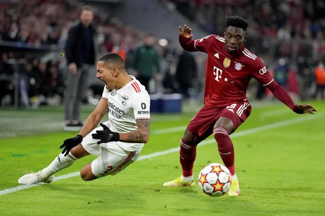 Bayern's Alphonso Davies, right, stops Benfica's Gilberto during the Champions League group E soccer match between Bayern Munich and Benfica Lisbon in Munich, Germany, Tuesday, Nov. 2, 2021. THE CANADIAN PRESS/AP-Matthias Schrader