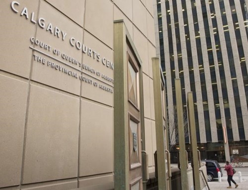 The Calgary Courts Centre is pictured in Calgary, Alta., Monday, March 11, 2019. A man who removed his mask and deliberately coughed on a server at a Calgary bar last year has been convicted of assault. THE CANADIAN PRESS/Jeff McIntosh