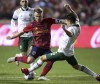 Real Salt Lake midfielder Albert Rusnak (11) tries to kick the ball past Portland Timbers defender Claudio Bravo (5) during an MLS soccer match Wednesday, Nov. 3, 2021, in Sandy, Utah. (Scott G Winterton/Deseret News via AP)