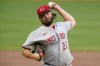 FILE - Cincinnati Reds starting pitcher Wade Miley delivers during the first inning of the team's baseball game against the Pittsburgh Pirates in Pittsburgh on Sept. 14, 2021. Miley was claimed off waivers by the Chicago Cubs from Cincinnati on Friday, Nov. 5, a surprising cost-cutting move by the Reds. A left-hander who turns 35 on Nov. 13, Miley was 12-7 with a 3.37 ERA in 28 starts, and he threw his first career no-hitter in a 3-0 win at Cleveland on May 7. (AP Photo/Gene J. Puskar, File)