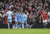 Manchester City players celebrates after Manchester United's Eric Bailly scored an own goal during the English Premier League soccer match between Manchester United and Manchester City at Old Trafford stadium in Manchester, England, Saturday, Nov. 6, 2021. (AP Photo/Jon Super)