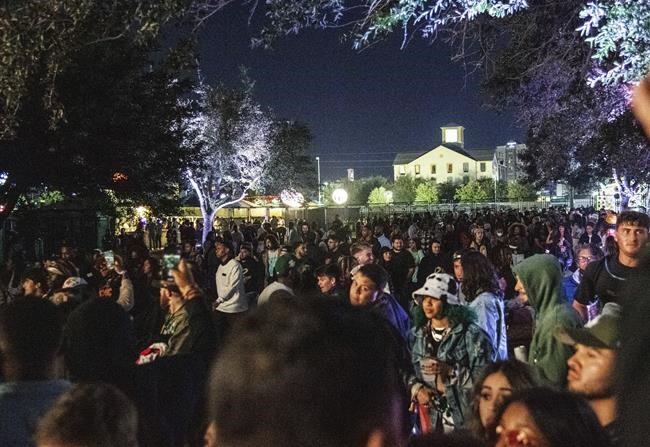 Festival goers are seen rushing into the VIP area prior to Travis Scott performing during day one of the Astroworld Music Festival at NRG Park on Friday, Nov. 5, 2021, in Houston. Several people died and numerous others were injured in what officials described as a surge of the crowd at the music festival while Scott was performing. (Photo by Amy Harris/Invision/AP)