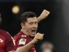 Bayern's Robert Lewandowski celebrates his side's second goal during the German Bundesliga soccer match between FC Bayern Munich and SC Freiburg in Munich, Germany, Saturday, Nov. 6, 2021. (AP Photo/Matthias Schrader)