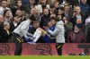 Chelsea's Kai Havertz is helped to return to the field after a tackle during the English Premier League soccer match between Chelsea and Burnley at the Stamford Bridge stadium in London, Saturday, Nov. 6, 2021. (AP Photo/Frank Augstein)
