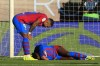 Barcelona's Ansu Fati, right, lies injured as Memphis Depay leans over him during a Spanish La Liga soccer match between Celta and Barcelona at the Balaidos stadium in Vigo, Spain, Saturday, Nov. 6, 2021. (AP Photo/Lalo R. Villar)