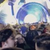 This still image taken from a cell phone video provided by Gabe Casey, fans attending a performance by rapper Travis Scott, shout to people to 