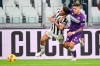 Fiorentina's Lucas Martinez Quarta, right, and Juventus' Paulo Dybala battle for the ball during the Serie A soccer match between Juventus Fc and ACF Fiorentina at Allianz Stadium in Torino, Italy, Saturday Nov. 6, 2021. (Fabio Ferrari/LaPresse via AP)
