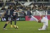 Bordeaux's Laurent Koscielny runs with the ball while PSG's Neymar falls during the soccer League One match Bordeaux against Paris Saint-Germain at the Matmut Atlantique stadium in Bordeaux, southwestern France, Saturday, Nov. 6, 2021. (AP Photo/Bob Edme)