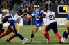 Winnipeg Blue Bombers quarterback Zach Collaros (8) gets pressure from Montreal Alouettes' Nick Usher (10) and Chris Ackie (21) during the first half of CFL action in Winnipeg Saturday, November 6, 2021.  THE CANADIAN PRESS/John Woods