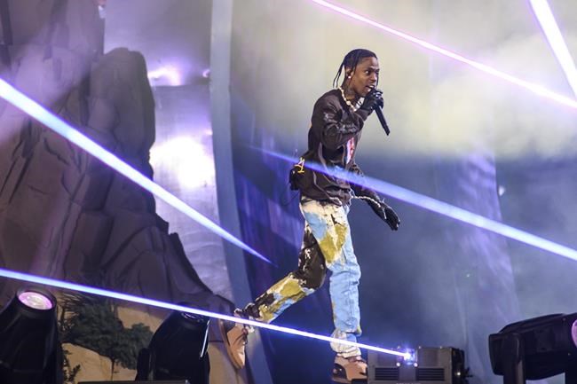 Travis Scott performs at Astroworld Festival at NRG park on Friday, Nov. 5, 2021 in Houston. Several people died and numerous others were injured in what officials described as a surge of the crowd at the music festival in while Scott was performing. Officials declared a “mass casualty incident” just after 9 p.m. Friday during the festival where an estimated 50,000 people were in attendance, Houston Fire Chief Samuel Peña told reporters at a news conference.(Jamaal Ellis/Houston Chronicle via AP)