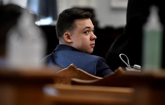 Kyle Rittenhouse looks back before his trial starts at the Kenosha County Courthouse in Kenosha, Wis., on Monday, Nov. 8, 2021. (Sean Krajacic/The Kenosha News via AP, Pool)