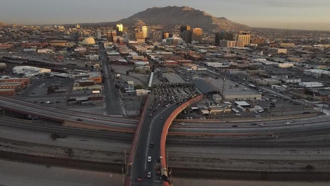 Cars line up at the Paso del Norte international bridge in Ciudad Juarez, Mexico, below, on the border with El Paso, Texas, top, Monday, Nov. 8, 2021. The U.S. fully reopened its borders with Mexico and Canada on Monday and lifted restrictions on travel that covered most of Europe amid the COVID-19 pandemic. (AP Photo/Christian Chavez)
