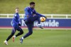 England's Reece James reaches for the ball during a training session ahead of the upcoming World Cup 2022 qualifying soccer match against Albania and San Marino, at St George's Park, Burton-upon-Trent, England, Tuesday, Nov. 9, 2021. (Nick Potts/PA via AP)