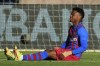 Barcelona's Ansu Fati, sits injured during a Spanish La Liga soccer match between Celta and Barcelona at the Balaidos stadium in Vigo, Spain, Saturday, Nov. 6, 2021. (AP Photo/Lalo R. Villar)