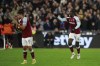 West Ham's Kurt Zouma, right, celebrates after scoring his side's 3rd goal during the English Premier League soccer match between West Ham United and Liverpool at the London stadium in London, England, Sunday, Nov. 7, 2021. (AP Photo/Ian Walton)