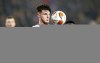 West Ham's Declan Rice, center, eyes the ball during a group H Europa League soccer match between Genk and West Ham at the KRC Genk Arena in Genk, Belgium, Thursday, Nov. 4, 2021. (AP Photo/Olivier Matthys)