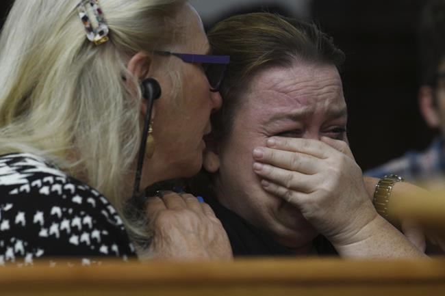 Wendy Rittenhouse, comforted by defense jury expert Jo-Ellan Dimitrius, gets emotional as her son Kyle Rittenhouse testifies during cross examination in his trial at the Kenosha County Courthouse in Kenosha, Wis., on Wednesday, Nov. 10, 2021. Rittenhouse is accused of killing two people and wounding a third during a protest over police brutality in Kenosha, last year. (Mark Hertzberg/Pool Photo via AP)