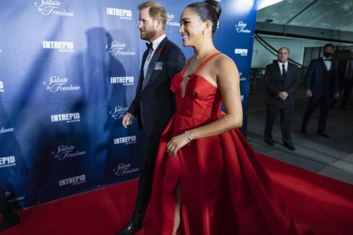FILE - Prince Harry and Meghan Markle, Duke and Duchess of Sussex, arrive at the Intrepid Sea, Air & Space Museum for the Salute to Freedom Gala Wednesday, Nov. 10, 2021, in New York. The Duchess of Sussex has apologized for misleading a British court about the extent of her cooperation with the authors of a sympathetic book about her and Prince Harry. The former Meghan Markle sued a U.K. newspaper for publishing a letter she wrote to her estranged father, Thomas Markle. (AP Photo/Craig Ruttle)
