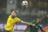 Australia's Harry Souttar, left, and Saudi Arabia Mohammed Kanno battle for the ball during the Asian qualifier World Cup 2022 third round group B match between Australia and Saudi Arabia in Sydney, Australia, Thursday, Nov. 11, 2021. (AP Photo/Rick Rycroft)
