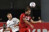 Toronto FC's Nick DeLeon, right, heads the ball in front of D.C. United's Drew Skundrich during second half MLS soccer action in Toronto on November 7, 2021. THE CANADIAN PRESS/Jon Blacker