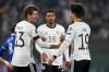 Germany's Leroy Sane, right, is congratulated by teammate Thomas Muller after he scored his team's fifth goal during the World Cup 2022 group J qualifying soccer match between Germany and Liechtenstein in Wolfsburg, Germany, Thursday, Nov. 11, 2021. (AP Photo/Michael Sohn)
