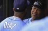FILE Tampa Bay Rays coach Ozzie Timmons, right, talks with Yandy Diaz in the dugout before a baseball game against the Toronto Blue Jays, July 11, 2021, in St. Petersburg, Fla. The Milwaukee Brewers will go with multiple hitting coaches next season after hiring Timmons and Connor Dawson to replace the fired Andy Haines. Brewers president of baseball operations David Stearns announced Thursday, Nov. 11, 2021, the team had selected Timmons and Dawson as part of their “hitting coach team at the major league level.” (AP Photo/Steve Nesius, File)