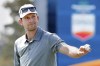 Martin Trainer acknowledges the gallery after sinking his putt on the 18th hole during the second round of the Houston Open golf tournament Friday, Nov. 12, 2021, in Houston. (AP Photo/Michael Wyke)