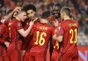 Belgium's Thorgan Hazard, center, is congratulated after scoring his sides third goal during the World Cup 2022 group E qualifying soccer match between Belgium and Estonia at the King Baudouin stadium in Brussels, Saturday, Nov. 13, 2021. (AP Photo/Olivier Matthys)