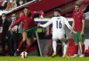 Portugal's Cristiano Ronaldo, left, duels for the ball with Serbia's Sasa Lukic during the World Cup 2022 group A qualifying soccer match between Portugal and Serbia at the Luz stadium in Lisbon, Sunday, Nov 14, 2021. (AP Photo/Armando Franca)